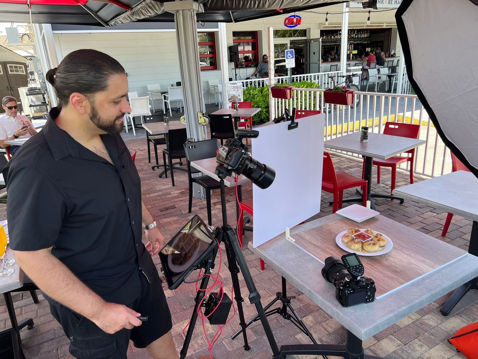 Photographing dishes on a restaurant patio